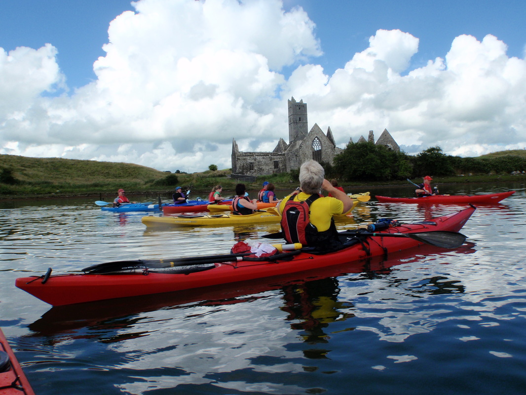 Kayaker enjoy the view of Rosserk Friary from the River Moy.