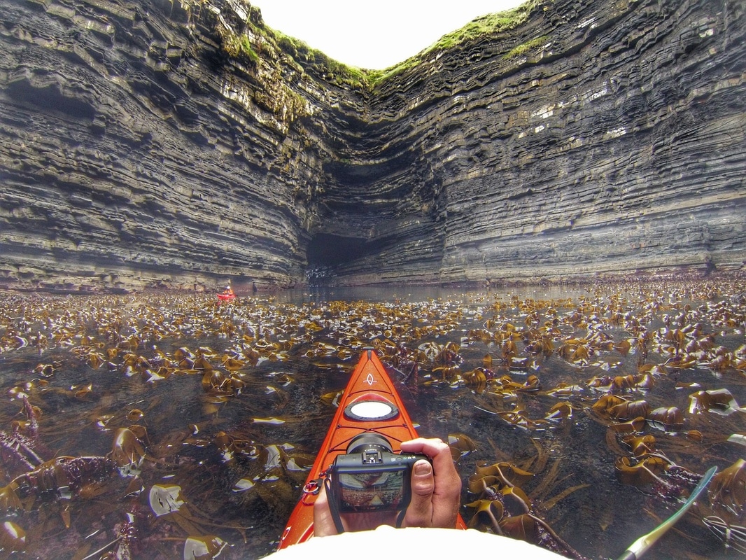 David Horkan exploring sea caves in Mayo 